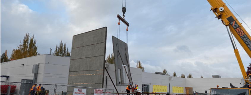 crane building lowering new wall of Training Center